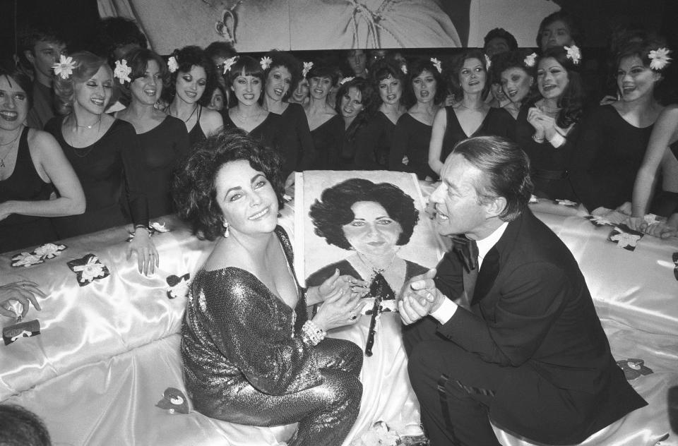 (Original Caption) 3/6/78-New York, NY- A radiant Elizabeth Taylor celebrates her recent 46th birthday at a Studio 54 party with designer Halston. The actress also celebrated the opening night of the film version of 