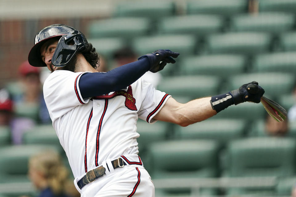 Atlanta Braves shortstop Dansby Swanson (7) hits a single in the sixth inning of a baseball game against the Philadelphia Phillies, Wednesday, Aug. 3, 2022, in Atlanta. (AP Photo/John Bazemore)