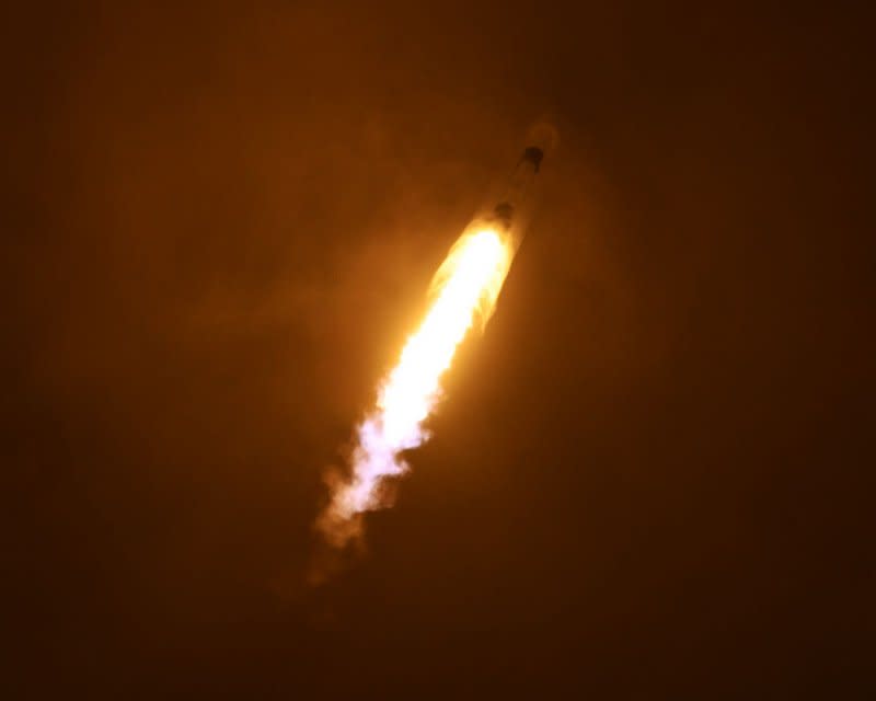 A SpaceX Falcon 9 rocket passes through a vapor plume as it goes supersonic while launching the Ovzon 3 satellite for the Swedish Internet provider from Launch Complex 40 at 6:04 p.m. from the Cape Canaveral Space Force Station, Fla., on Wednesday. Photo by Joe Marino/UPI