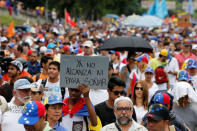 Opposition supporters rally against President Nicolas Maduro carrying a sign that reads, "We can not even dream anymore", in Caracas, Venezuela May 3, 2017. REUTERS/Carlos Garcia Rawlins