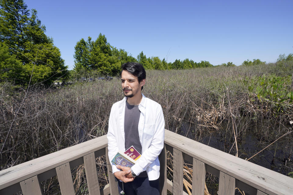 Ricardo Ramirez poses for a photograph during an interview Thursday, April 23, 2020, near his home in Houston. Ramirez is observing Ramadan for the first time as a Muslim after converting to Islam last year. Ramadan is typically a time of communal meals and praying in congregation. This year, the month comes as the coronavirus pandemic has disrupted Islamic worship and spurred mosque closures to the public. (AP Photo/David J. Phillip)