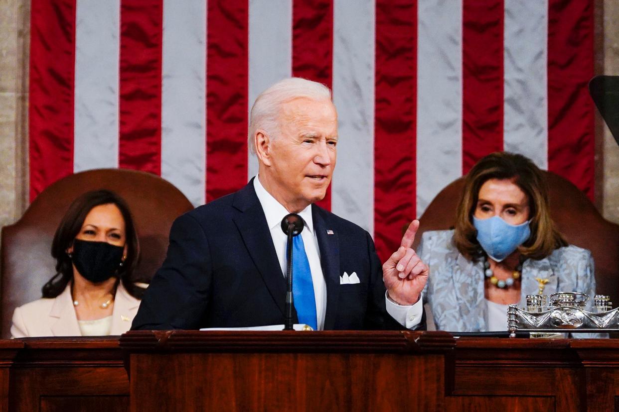 <p>FILE - In this April 28, 2021, file photo President Joe Biden addresses a joint session of Congress in the House Chamber at the U.S. Capitol in Washington, as Vice President Kamala Harris, left, and House Speaker Nancy Pelosi of Calif., look on.</p> ((Melina Mara/The Washington Post via AP, Pool))