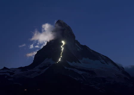 Solar powered lights are pictured along the Hoernli ridge on the Matterhorn in Zermatt, Switzerland, July 13, 2015. REUTERS/Denis Balibouse