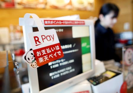 A campaign advertising of Rakuten Pay, QR code mobile payment system operated by Rakuten, is displayed at a coffee shop in Tokyo