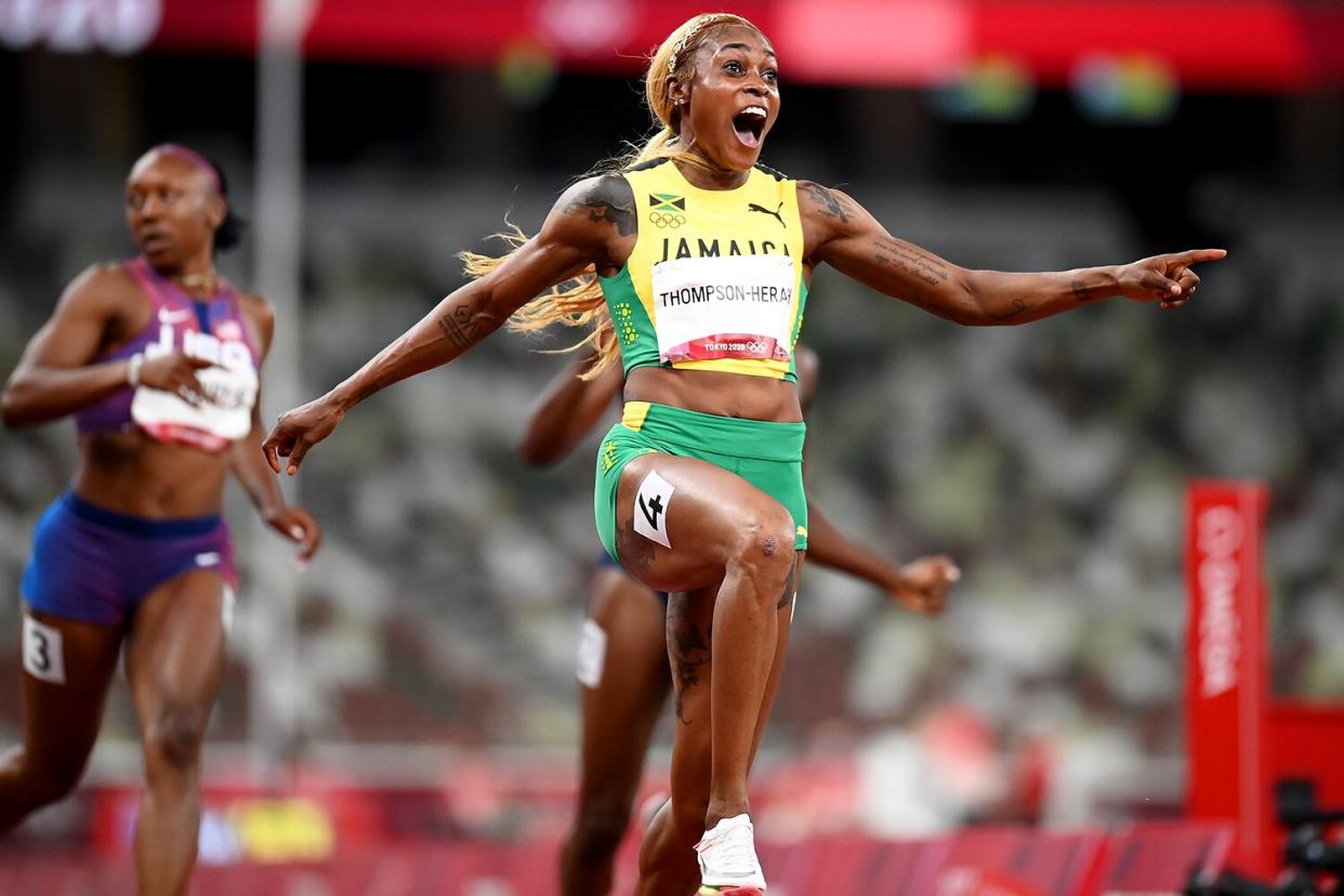 Elaine Thompson-Herah of Team Jamaica celebrates after winning the gold medal in the Women's 100m Final on day eight of the Tokyo 2020 Olympic Games at Olympic Stadium on July 31, 2021 in Tokyo, Japan.