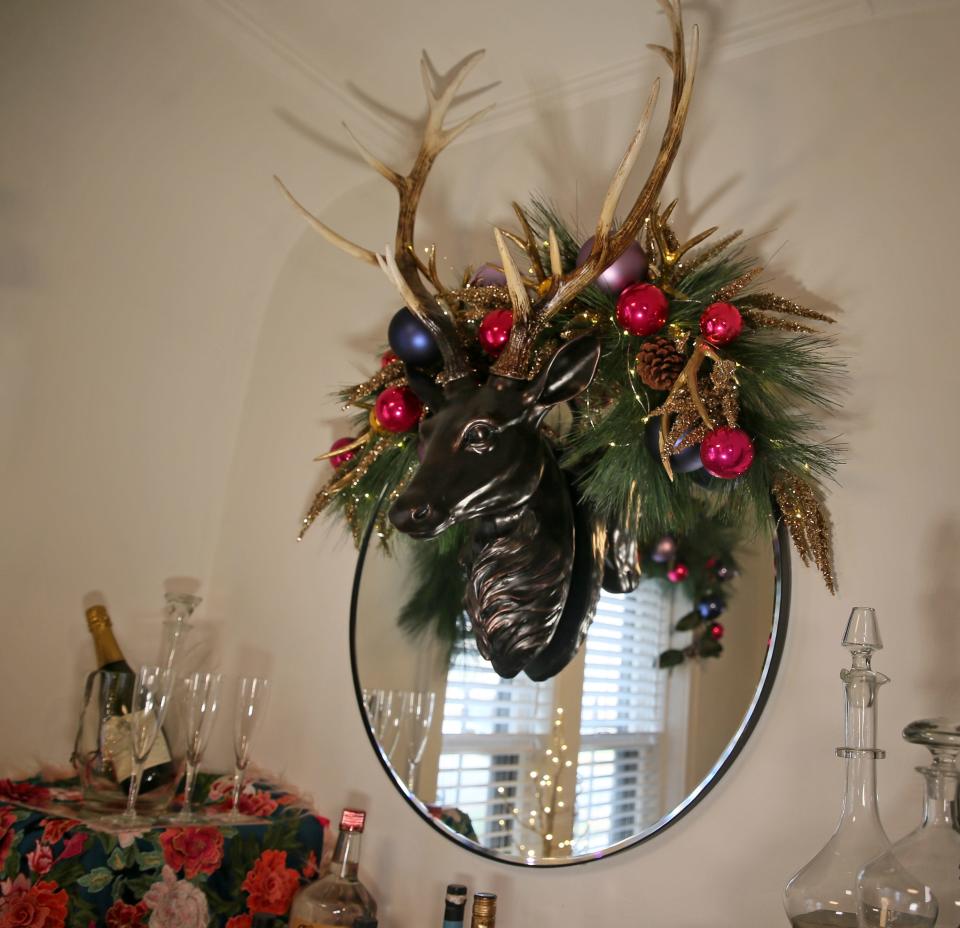 A faux reindeer topped with garland decorates the bar area of Jeff Ketterhagen's kitchen.