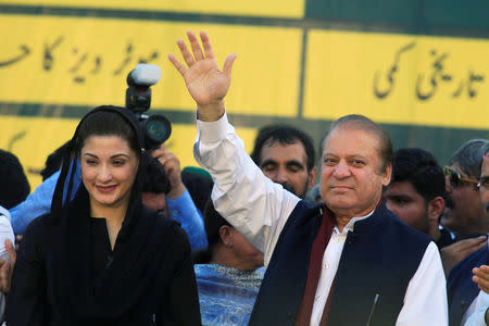 FILE PHOTO: Nawaz Sharif (R), former Prime Minister and leader of Pakistan Muslim League, gestures to supporters as his daughter Maryam Nawaz looks on during party's workers convention in Islamabad, Pakistan June 4, 2018. REUTERS/Faisal Mahmood/File Photo