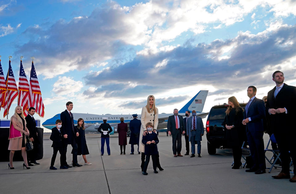 Trump family members stand on the tarmac at Joint Base Andrews in Maryland as they arrive for President Donald Trump's departure on Jan. 20.<span class="copyright">Alex Edelman—AFP/Getty Images</span>