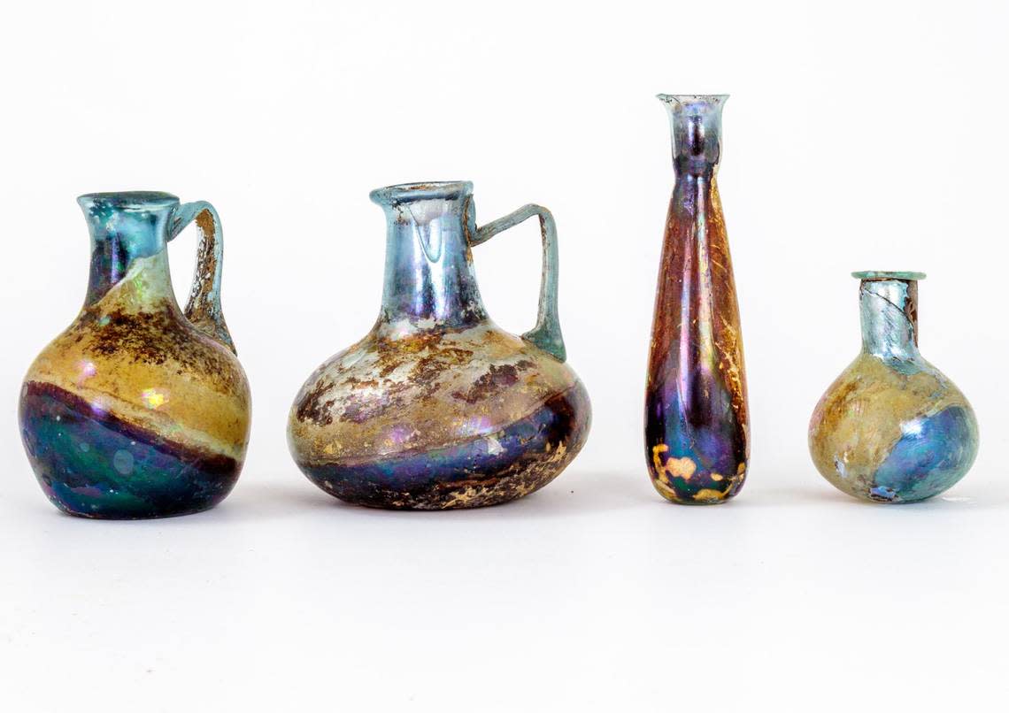 The glass vases have stayed in near pristine condition buried in the tombs, photos show.