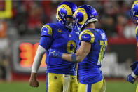 Los Angeles Rams quarterback Matthew Stafford (9) celebrates with wide receiver Cooper Kupp (10) after his reception against the Tampa Bay Buccaneers during the second half of an NFL divisional round playoff football game Sunday, Jan. 23, 2022, in Tampa, Fla. (AP Photo/Jason Behnken)