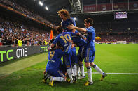 <p>Fernando Torres of Chelsea is mobbed by his team mates after scoring the opening goal.</p>