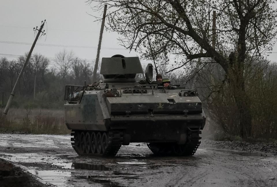 Ukrainian servicemen were driven to Bakhmut inside an M113 armoured vehicle on Friday (REUTERS/Sofiia Gatilova)