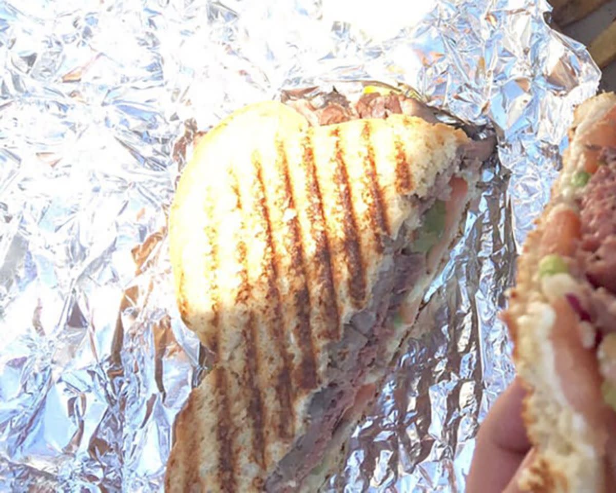 The Vermonter Sandwich on aluminium foil, Jericho Center Country Store, Jericho, Vermont, sunlight is shining on it