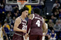 Texas A&M guard Andre Gordon (20) reacts with guard Wade Taylor IV (4) during the first half an NCAA college basketball game against LSU in Baton Rouge, La., Wednesday, Jan. 26, 2022. (AP Photo/Matthew Hinton)