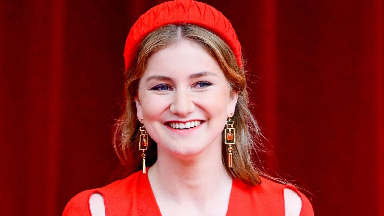 Princess Elisabeth in a red dress and headband