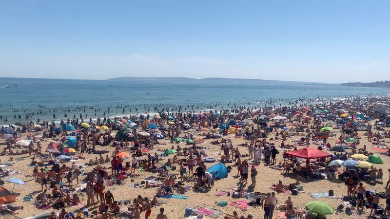 People enjoy the hot weather at the beach in Bournemouth