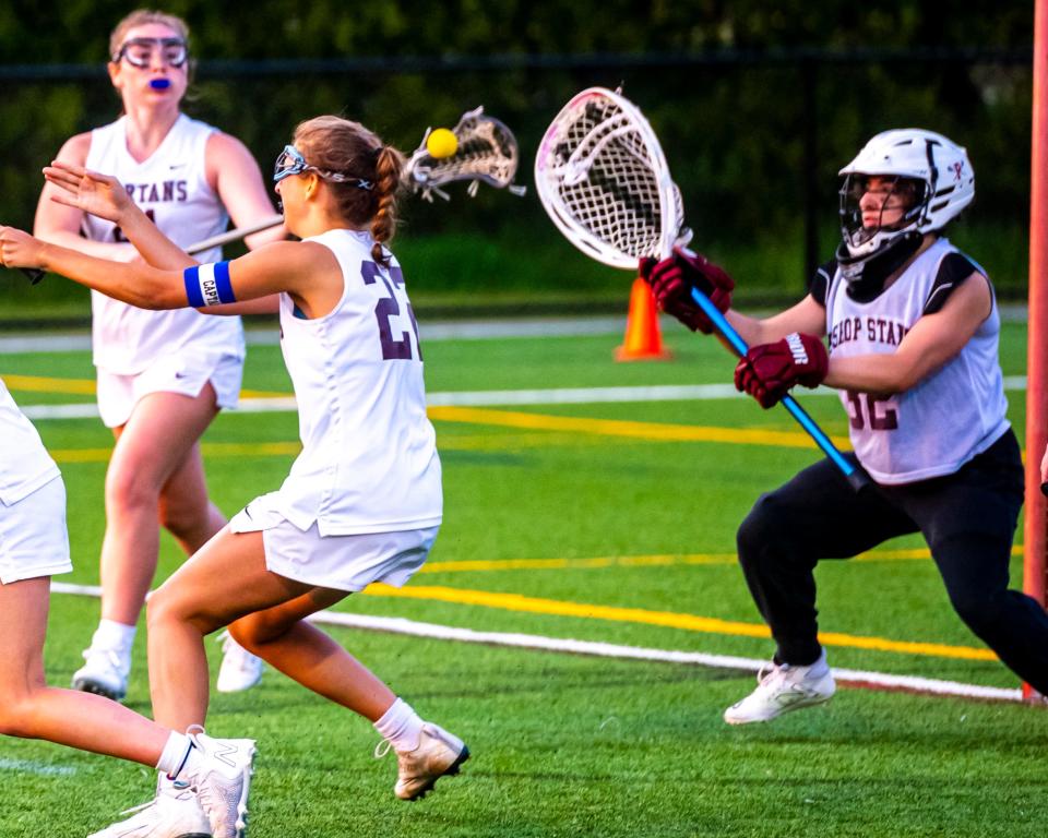 Bishop Stang's Isabella Batista makes the save.