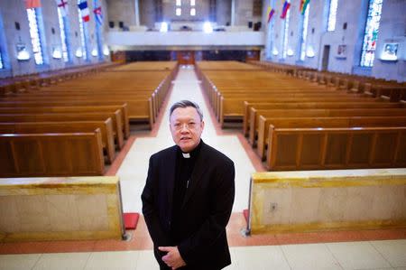 Monsignor Joseph Trinh has been a pastor at St. Helena's Parish for 17 years in Philadelphia, Pennsylvania, United States, May 12, 2015. REUTERS/Mark Makela