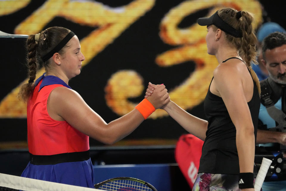 Elena Rybakina, right, of Kazakhstan is congratulated by Jelena Ostapenko of Latvia following their quarterfinal match at the Australian Open tennis championship in Melbourne, Australia, Tuesday, Jan. 24, 2023. (AP Photo/Aaron Favila)