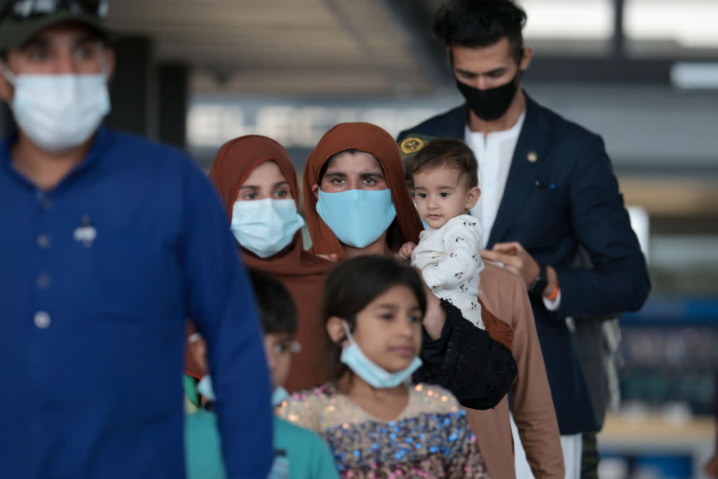 Afghan Refugees Arrive At Dulles Airport After US Pulls Out Final Troops