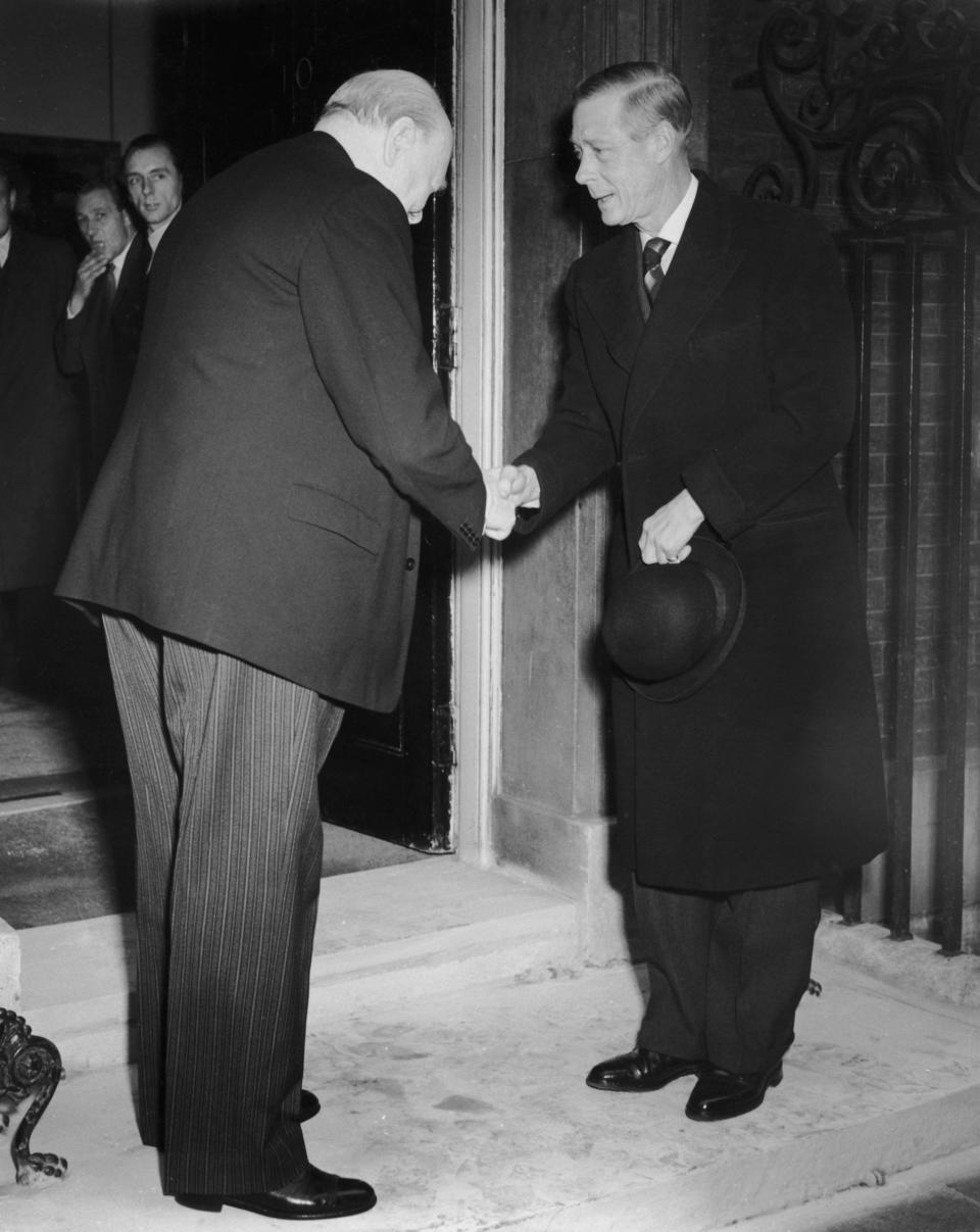 The Duke of Windsor (formerly King Edward VIII) shakes hands with British Prime Minister Winston Churchill - Credit:  Central Press