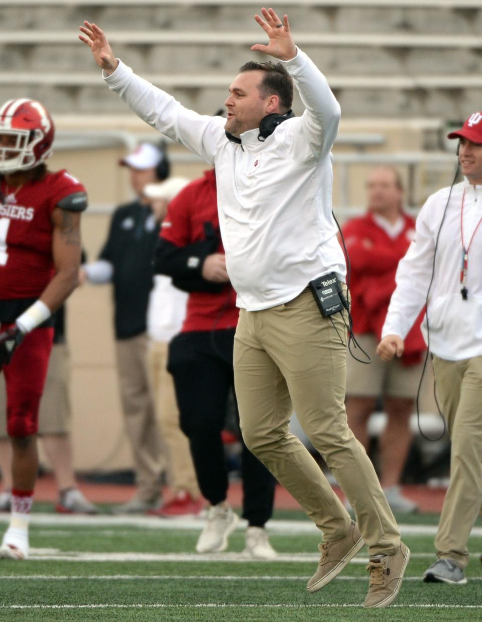 Indiana Hoosiers defensive coordinator Kane Wommack celebrates after the defense forced a turnover during the Cream-Crimson spring game at Memorial Stadium in Bloomington, Ind., on Friday, April 12, 2019.