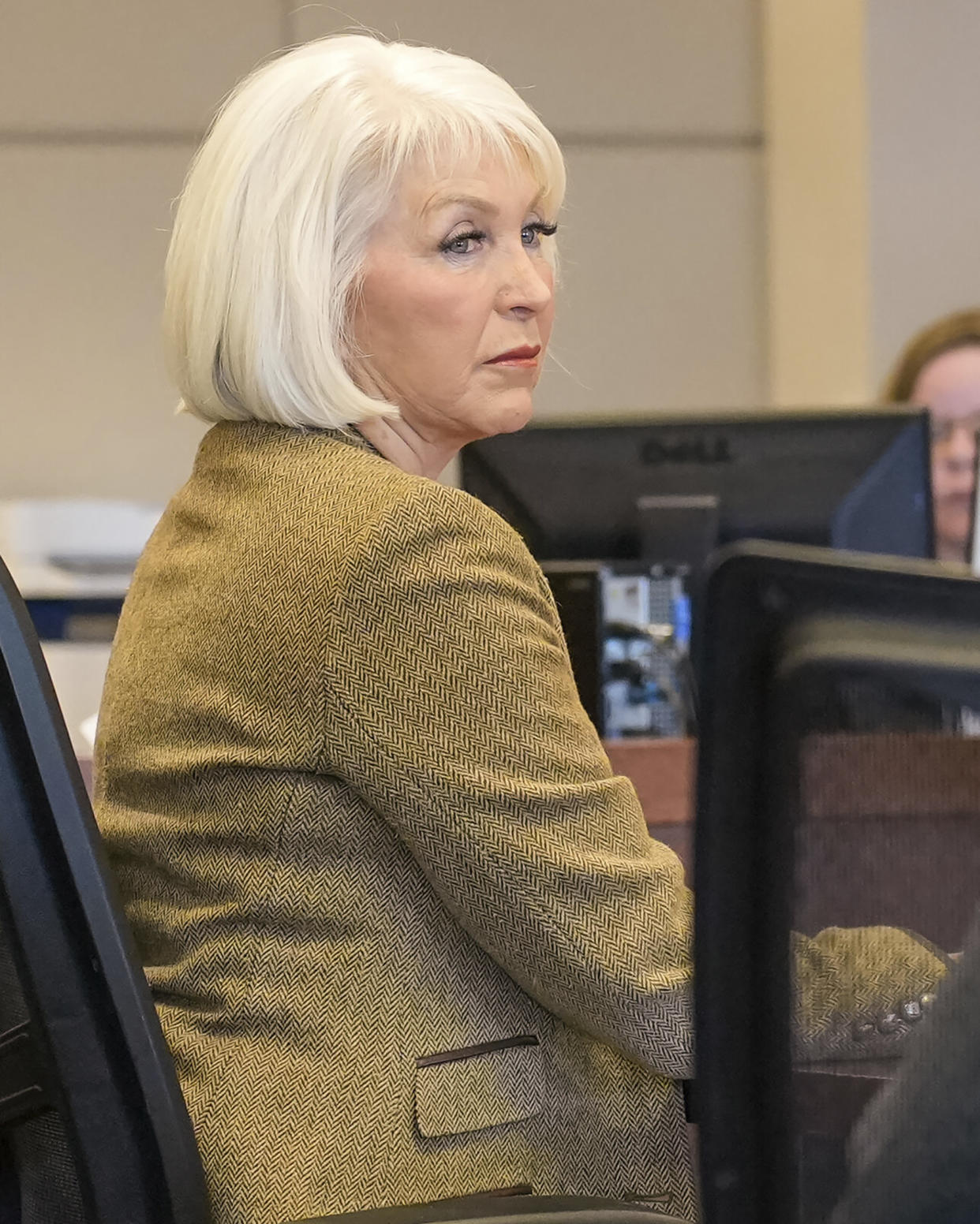 Tina Peters, former Mesa County, Colo., clerk, listens during her trial, Friday, March 3, 2023, in Grand Junction, Colo. Peters was convicted of a misdemeanor obstruction charge for refusing to turn over an iPad she allegedly used to videotape a court hearing. Jurors found the former clerk guilty of obstructing government operations but acquitted her of obstructing a peace officer. The case is separate from Peters' alleged involvement in a security break of voting machines. (Scott Crabtree/The Grand Junction Daily Sentinel via AP, Pool)