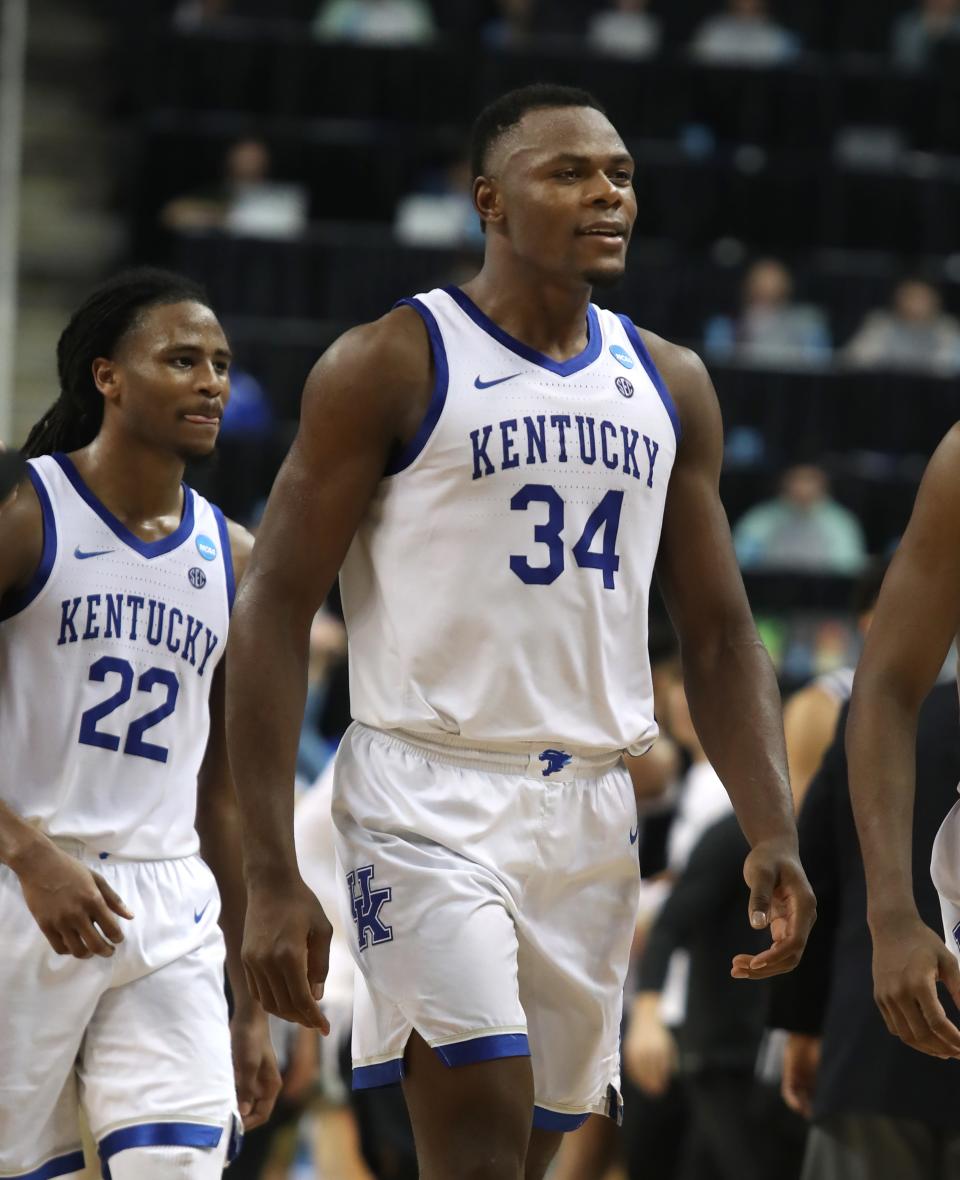Kentucky’s Oscar Tshiebwe and Cason Wallace walk off the court after beating Providence in the NCAA Tournament. March 17, 2023