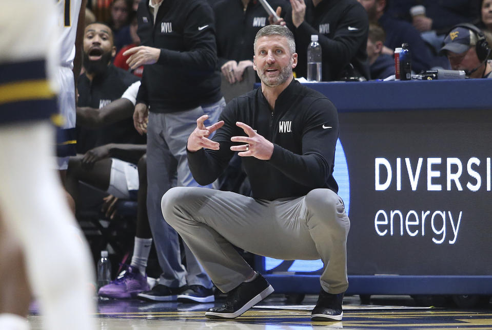 West Virginia coach Josh Eilert reacts during the second half of an NCAA college basketball game against Kansas, Saturday, Jan. 20, 2024, in Morgantown, W.Va. (AP Photo/Kathleen Batten)