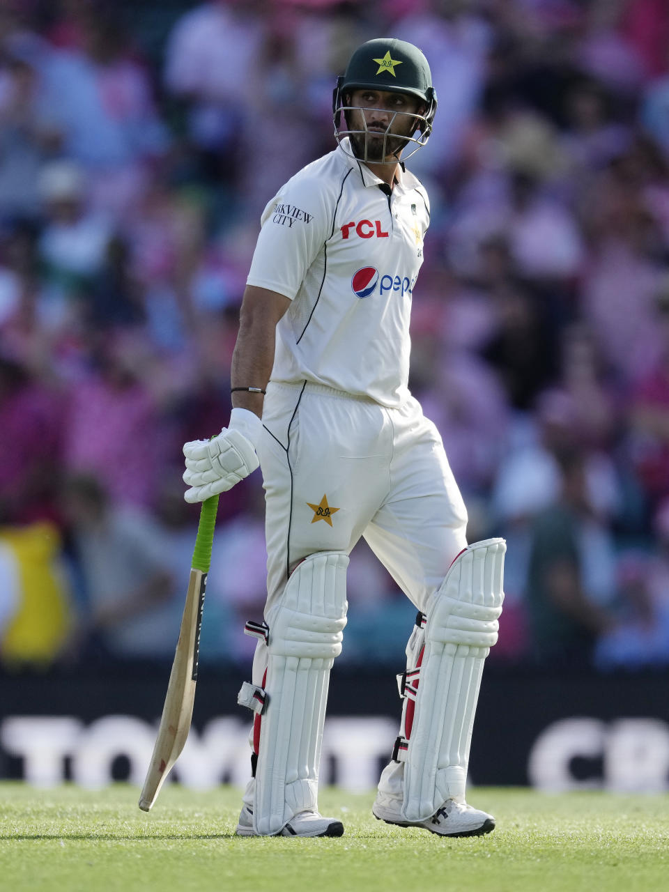 Pakistan's Agha Salman walks off after he lost his wicket to Australia's Josh Hazlewood on the third day of their cricket test match in Sydney, Friday, Jan. 5, 2024. (AP Photo/Rick Rycroft)