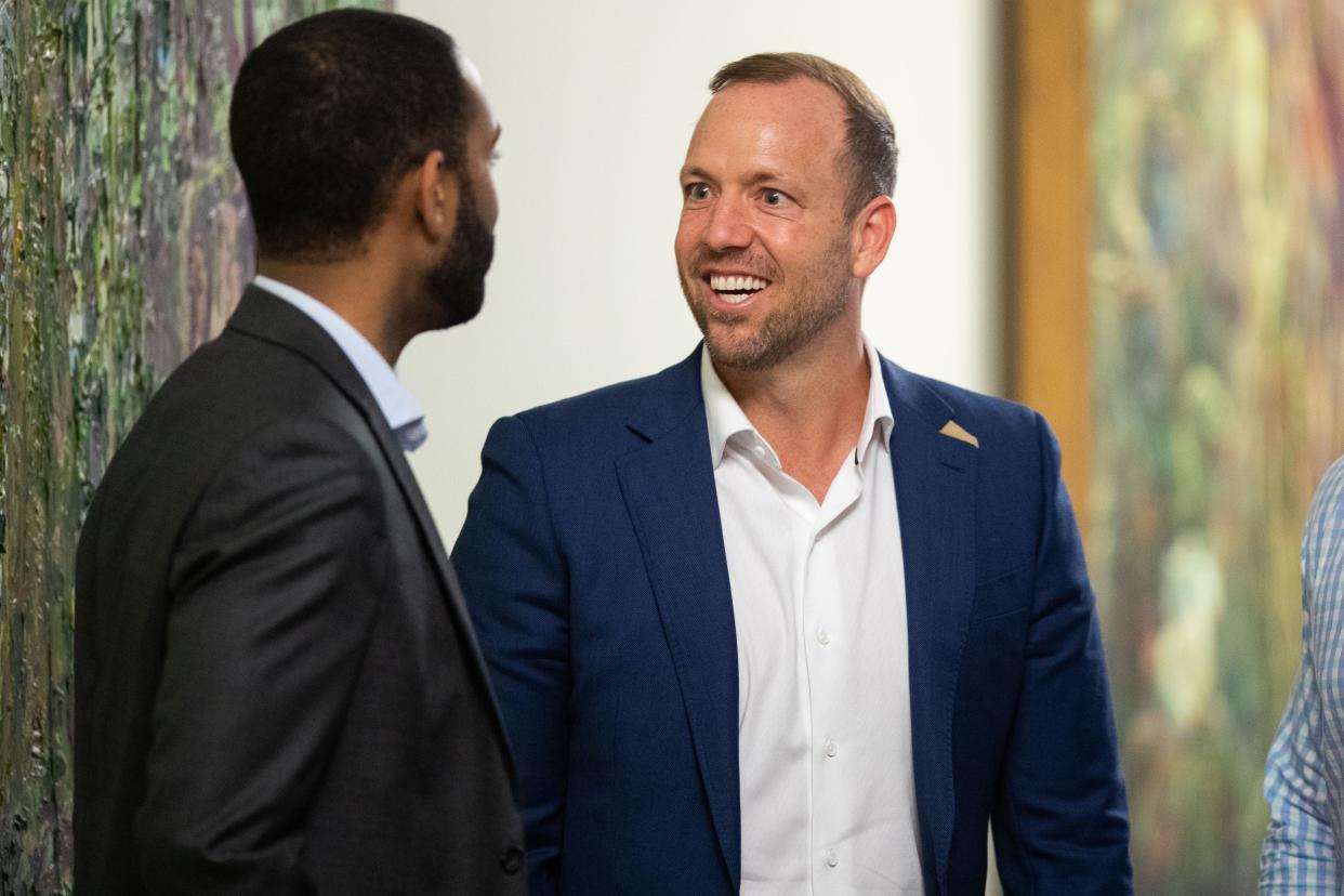 Businessman Adam Corey talks with someone following NAI TALCOR's Market Update Event held at the Turnbull Center on Monday, March 25, 2024.