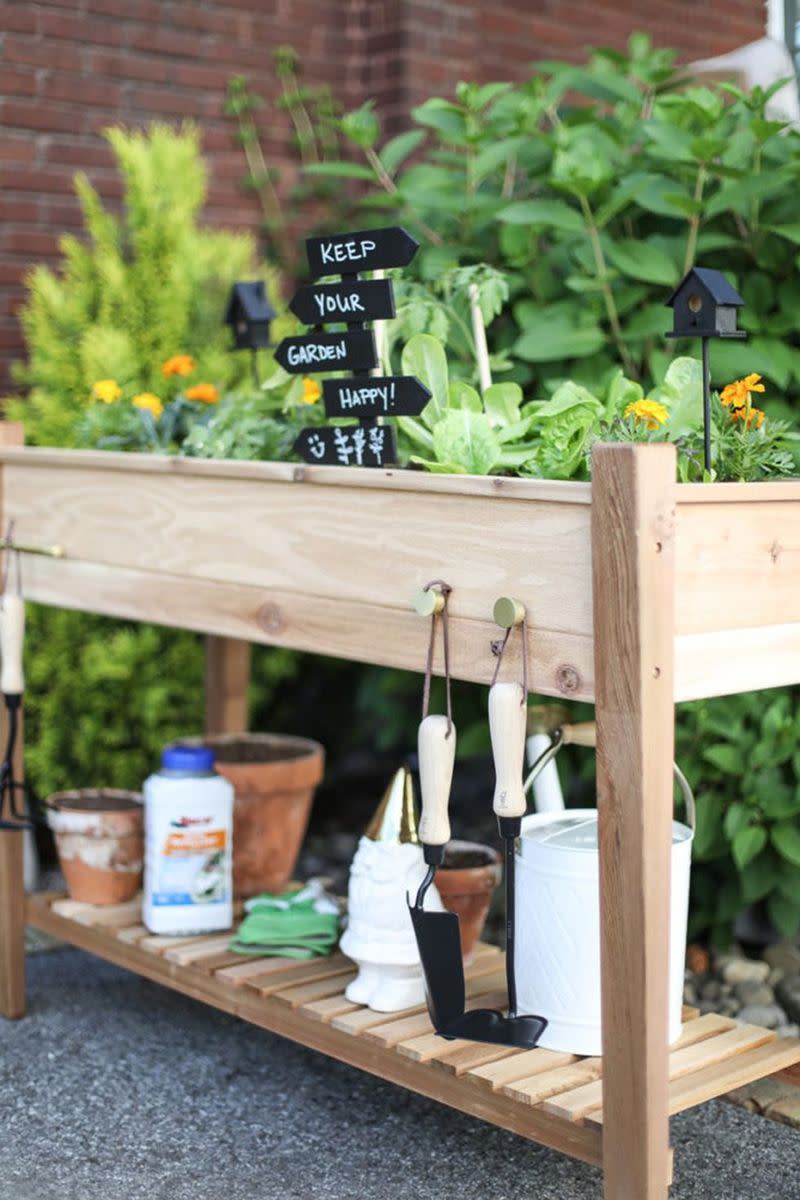 <p>Double your function with a design that features a garden bed on top and a shelf for supplies on the bottom. Plus, add a few knobs to hang your everyday tools. This convenient setup is ideal if you're lacking the space for a garden plot. </p><p><em><a href="https://inspiredbycharm.com/4-steps-to-a-raised-vegetable-garden/" rel="nofollow noopener" target="_blank" data-ylk="slk:Get the tutorial at Inspired By Charm »;elm:context_link;itc:0;sec:content-canvas" class="link ">Get the tutorial at Inspired By Charm »</a></em></p>