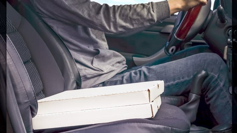 Pizza boxes on car seat