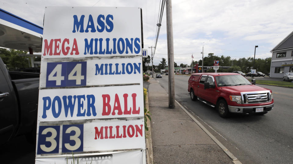 A truck passes a sign showing the lottery jackpots outside Ted's Stateline Mobil on Wednesday, June 24, 2020, in Methuen, Mass. The coronavirus pandemic has been a rollercoaster for state lotteries across the country, with some getting a boost from the economic downturn and others scrambling to make up for revenue shortfalls. (AP Photo/Charles Krupa)