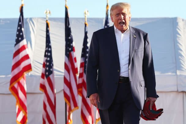 PHOTO: Former President Donald Trump walks to the podium for a campaign rally at Legacy Sports USA on Oct. 9, 2022, in Mesa, Ariz. (Mario Tama/Getty Images)