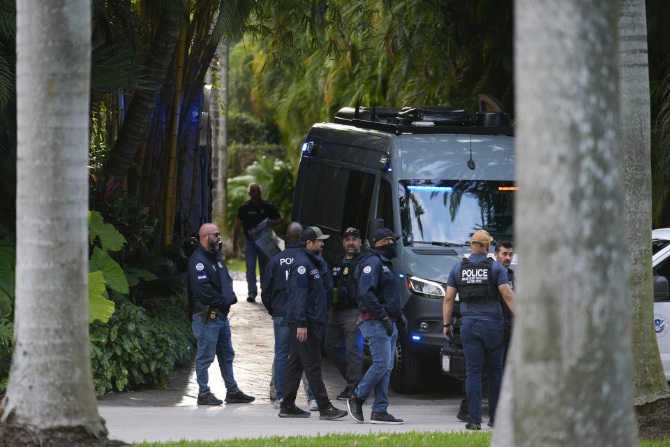 Law enforcement agents stand at the entrance to a property belonging to rapper Sean "Diddy" Combs, Monday, March 25, 2024, on Star Island in Miami Beach, Fla. Two properties belonging to Combs in Los Angeles and Miami were searched by federal Homeland Security Investigations agents and other law enforcement as part of an ongoing sex trafficking investigation by federal authorities in New York, two officials told The Associated Press. (AP Photo/Rebecca Blackwell)