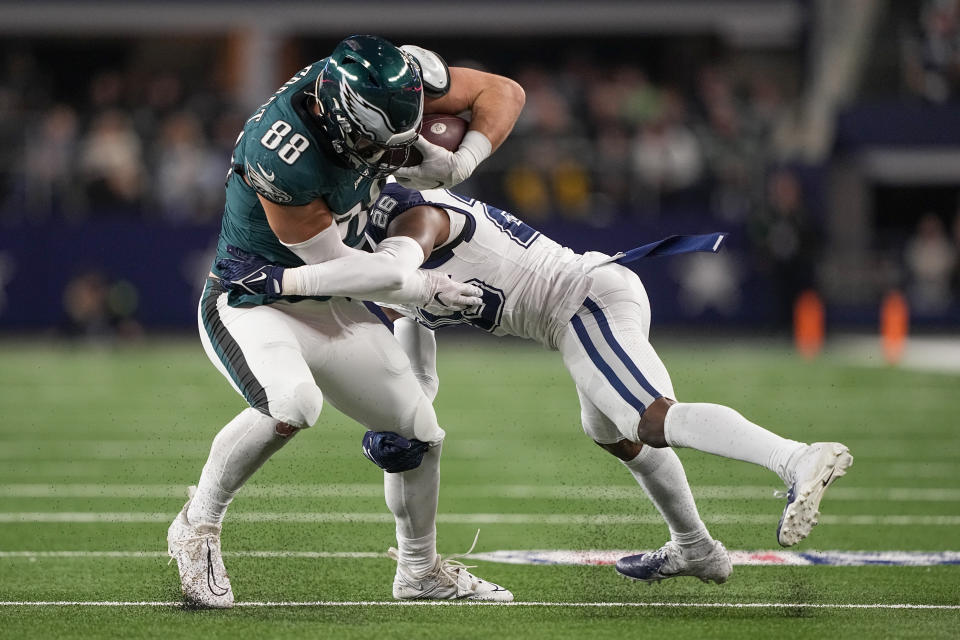 Philadelphia Eagles tight end Dallas Goedert (88) is stopped by Dallas Cowboys cornerback DaRon Bland (26) after making a catch during the first half of an NFL football game, Sunday, Dec. 10, 2023, in Arlington, Texas. (AP Photo/Tony Gutierrez)