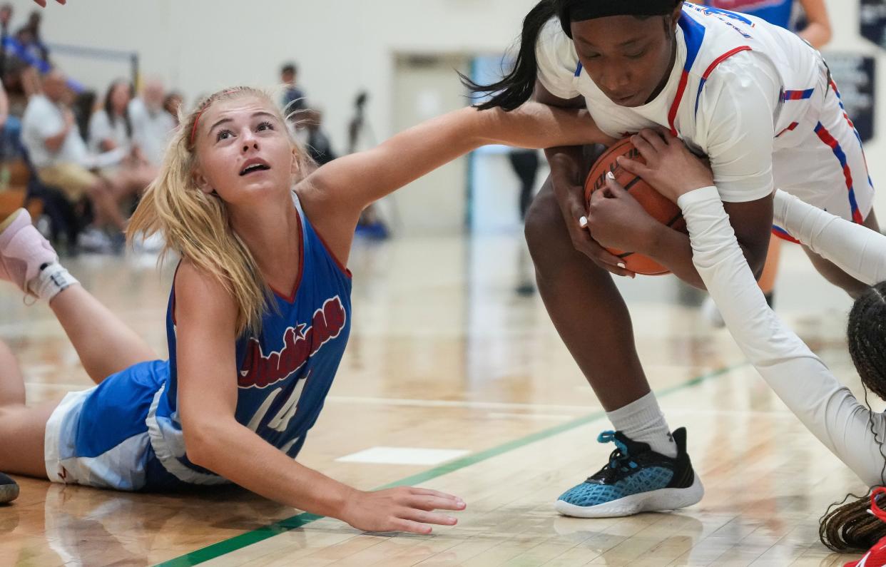 Indiana All-Star Junior Adrianne Tolen (14) reaches for the ball Wednesday, June 7, 2023, during the Indiana All-Stars vs. Juniors girls game at Cathedral High School in Indianapolis. 