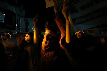 Protesters gather outside Terminal 4 at JFK airport in opposition to U.S. president Donald Trump's proposed ban on immigration in Queens, New York City, U.S., January 28, 2017. REUTERS/Stephen Yang -