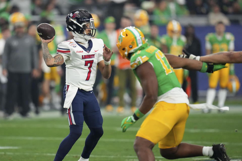 Liberty quarterback Kaidon Salter (7) throws against Oregon during the first half on the NCAA Fiesta Bowl college football game, Monday, Jan. 1, 2024, in Glendale, Ariz. (AP Photo/Ross D. Franklin)