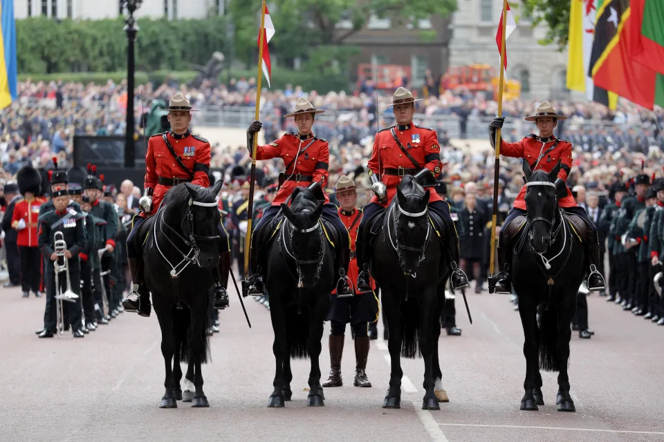 Royal Canadian Mounted Police led the procession during the state funeral of Queen Elizabeth II at Westminster Abbey on Sept. 19, 2022 in London, England. (Photo by Marko Djurica - WPA Pool/Getty Images)