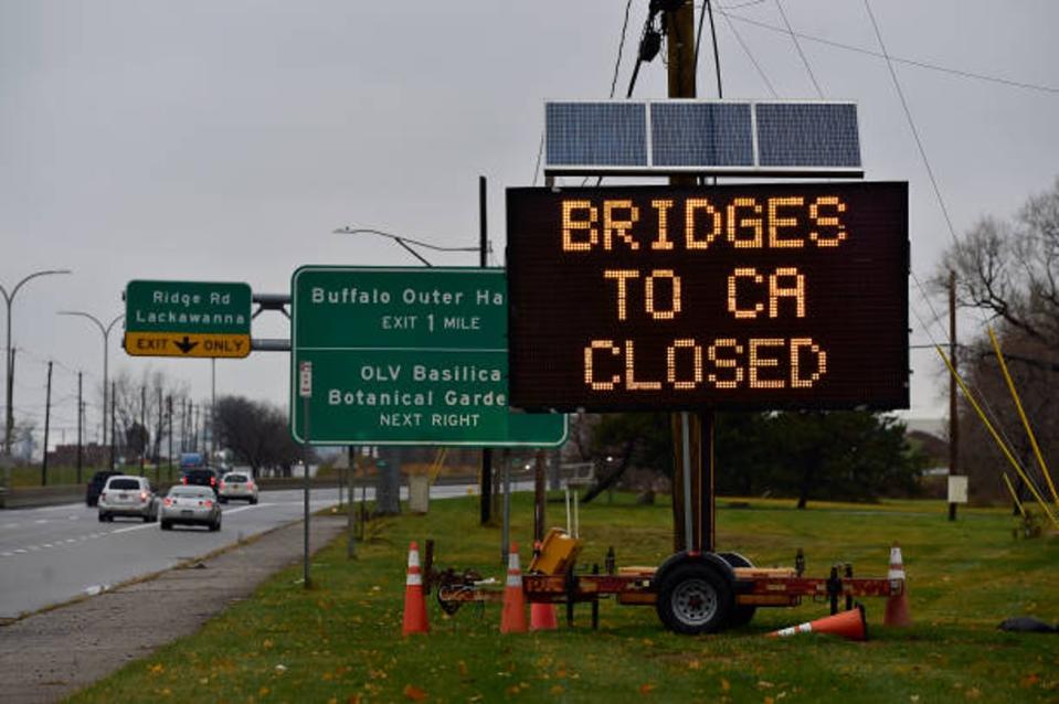 A sign indicates that all bridges between the US and Canada are closed after a car crashed and exploded at The Rainbow Bridge on 22 November 2023 (Getty Images)