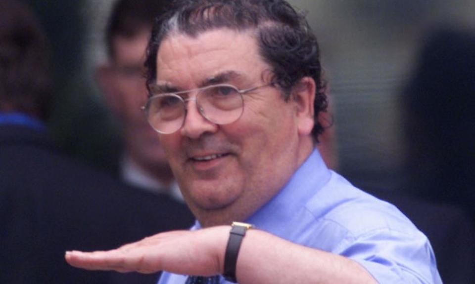 Former Social Democratic Labour Party leader John Hume signals outside the Castle Buildings, Stormont, Belfast, Friday, July 2, 1999.