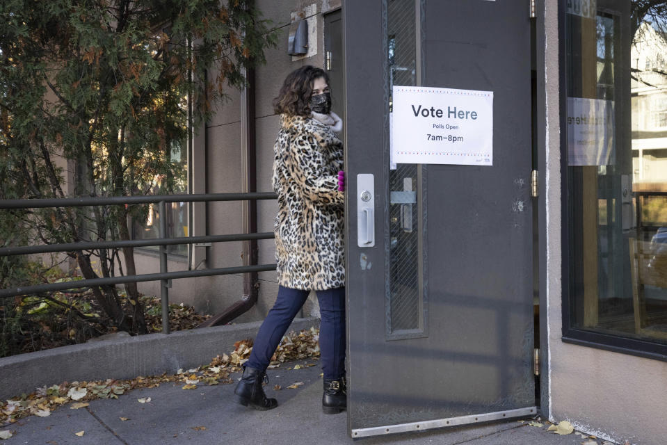 Mayoral candidate Sheila Nezhad walks into the Gichitwaa Kateri Catholic Church on Election Day to cast her vote on Tuesday, Nov. 2, 2021 in Minneapolis. Voters in Minneapolis are deciding whether to replace the city's police department with a new Department of Public Safety. The election comes more than a year after George Floyd's death launched a movement to defund or abolish police across the country.(AP Photo/Christian Monterrosa)