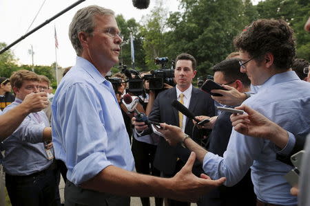 Republican presidential candidate Jeb Bush answers a questions from reporters following a town hall campaign stop at the VFW Post in Hudson, New Hampshire, July 8, 2015. REUTERS/Brian Snyder