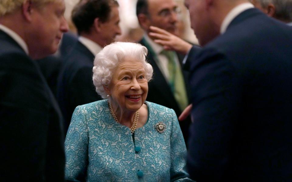 The Queen and Boris Johnson greet guests at a reception for the Global Investment Summit in Windsor Castle on Tuesday - AP Photo/Alastair Grant, Pool