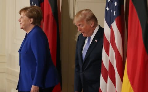 Mr Trump and Mrs Merkel reportedly have a strained relationship - Credit: Mark Wilson/Getty