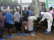 <p>Family of victims of heavy flooding and mudslides in Regent wait to identify their bodies at Connaught hospital morgue in Sierra Leone, Freetown, Aug. 16 , 2017. (Photo: Manika Kamara/AP) </p>