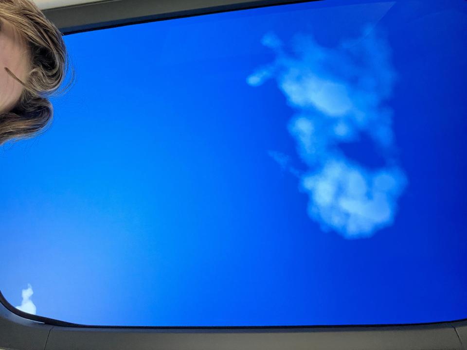 A blue sky displayed on a screen in the roof on an Eve Air Mobility eVTOL