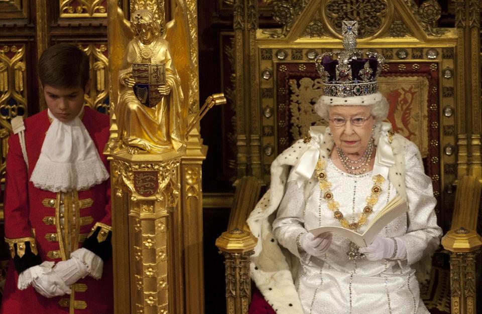 CORRECTS DATE TO 2012 Britain's Queen Elizabeth II reads the Queen's Speech to lawmakers in the House of Lords in London, Wednesday, May 9, 2012. Queen Elizabeth II said Wednesday that Britain's government plans to finally reform the centuries-old House of Lords and introduce direct elections for members. Announcing the government's new legislative program in an opulent pageant of pomp and politics, the queen said planned laws would introduce a smaller, mainly upper elected chamber. (AP Photo/Alastair Grant, Pool)